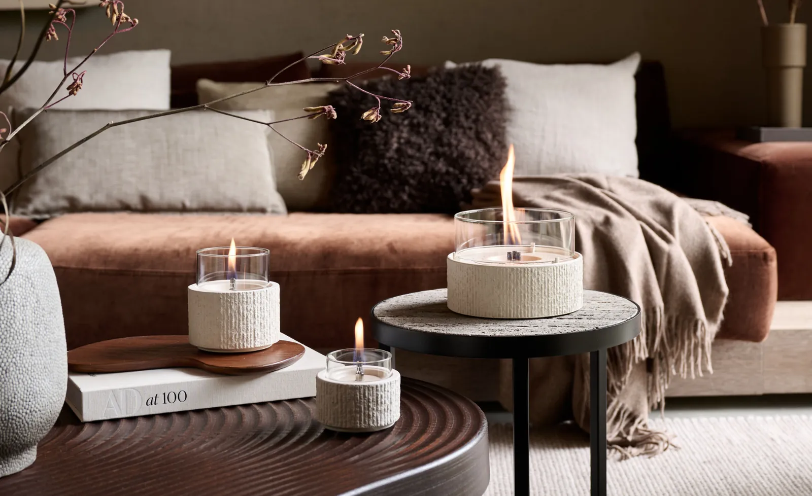 Tenderflame concrete candles on a coffee table in a calm interior